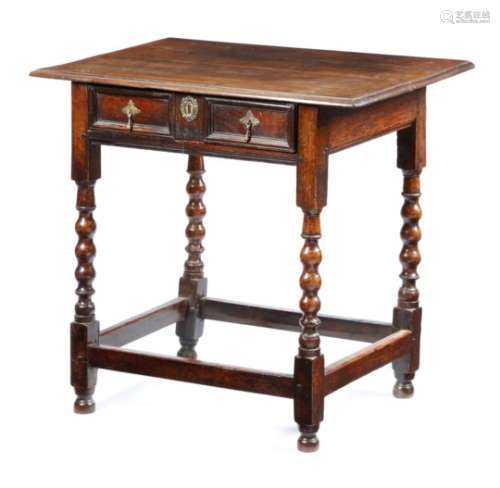 A William and Mary oak side table, the top with a moulded edge, above a twin panelled front frieze