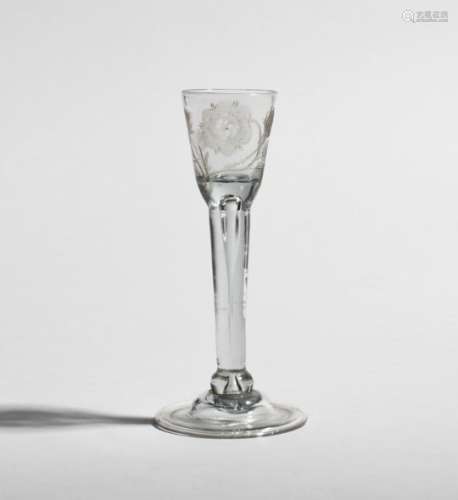 An Irish cordial glass of Jacobite significance c.1740-50, the small rounded funnel bowl engraved