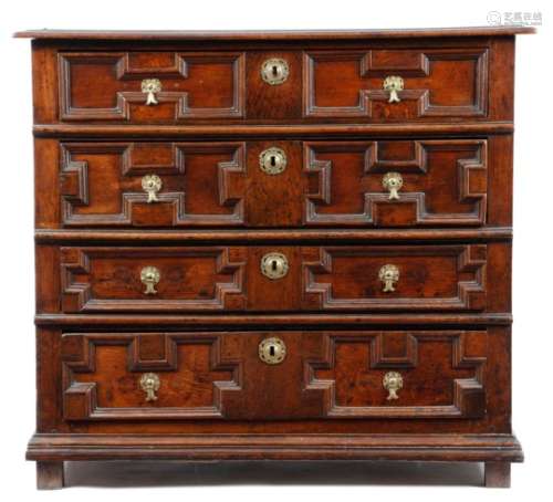 A William and Mary oak chest, the boarded top with a moulded edge above four long graduated