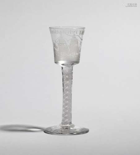 A privateer wine glass c.1760, the bucket bowl engraved with a two masted ship at sail beneath the