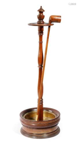 An early 19th century mahogany church warden's pipe stand, with three apertures above a baluster