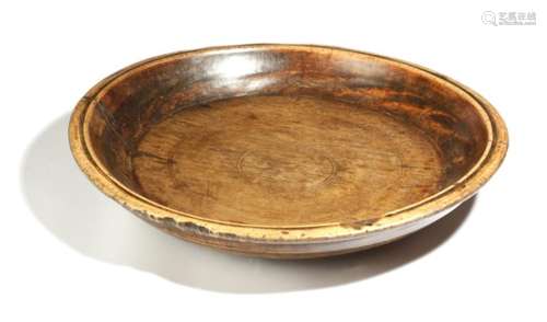 A 19th century treen dairy bowl, 58.7cm diameter.