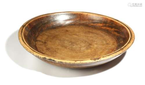A 19th century treen dairy bowl, 58.7cm diameter.