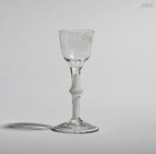 A small wine glass of possible Jacobite interest c.1760, the rounded funnel bowl engraved with a