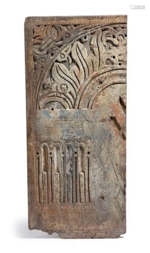 A rare oak and polychrome decorated panel fragment, carved with leaves and a stop fluted column