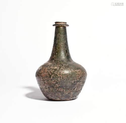 An English wine bottle c.1660-70, of shaft and globe type, the tapering neck with a significant