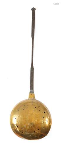 A late 17th century brass warming pan, with a pierced iron handle, the hinged lid pierced and