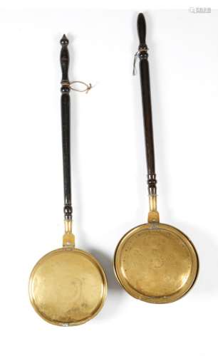 An early George III brass warming pan, with a turned fruitwood handle, the top of the hinged lid