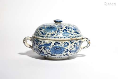 A Delft broth bowl or milk tureen and cover c.1690, the circular form painted in blue with birds