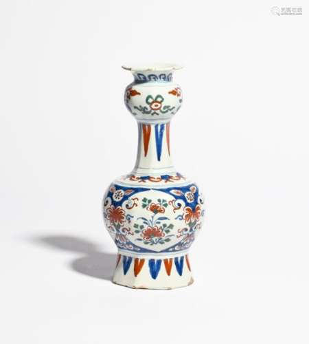 A Delft vase or guglet c.1700, the baluster form painted in red, blue and green with panels of