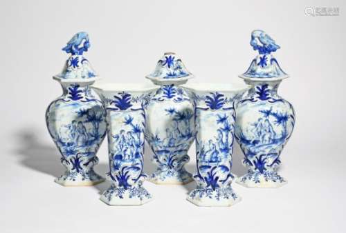 A garniture of five Delft vases 19th century, two sleeve vases and three baluster vases and