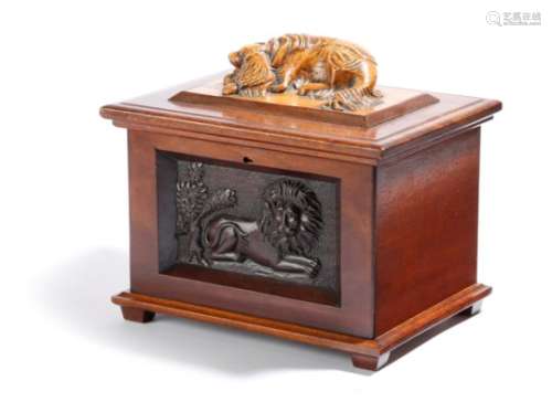 A Victorian folk art mahogany box, the hinged lid with a carved maple model of a spaniel, with a