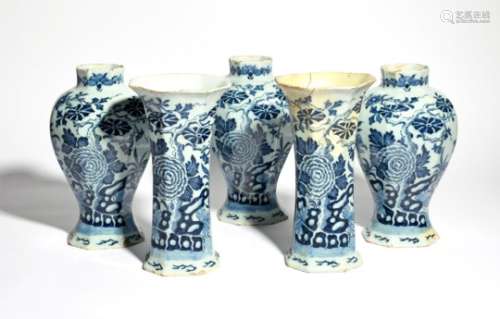 A garniture of five Delft vases c.1730-40, comprising three baluster vases and two sleeve vases,