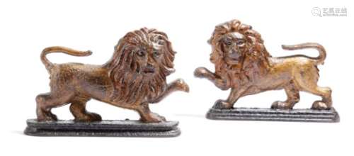Two similar Victorian painted cast iron chimney ornaments, or doorstops in the form of lions, 15.7cm