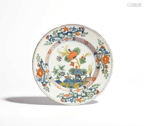 An Italian Faenza faïence plate c.1780, Ferniani workshop, painted in famille verte enamels with