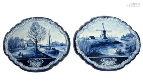 A pair of Frisian/Delft large plaques 19th century, painted in blue with landscapes including a