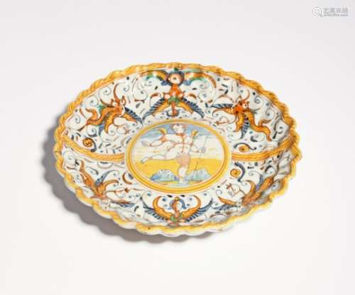 A Deruta maiolica tazza or crespina early 17th century or later, the lobed form raised on a low