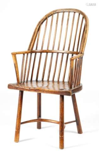 A George III Welsh ash stick-back Windsor style armchair, the bow back above a shaped elm bell-