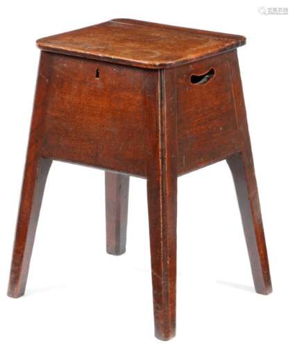 A George III elm box stool, the hinged seat above a handgrip pierced to each side, on moulded and