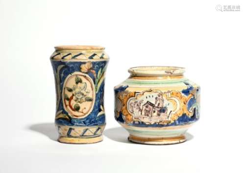 A Sicilian maiolica jar late 17th century, one of unusual squat form, painted with a small landscape
