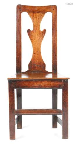 A small George III oak side chair, the vase shape splat-back above a solid seat, on stretchered