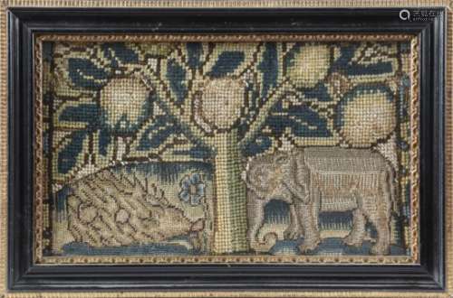A 17th century needlework fragment panel, worked with gros and petit point with an elephant and a