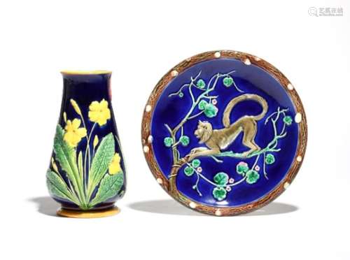 A Wedgwood Majolica small plate c.1880-90, moulded with a monkey clambering among flowering branches