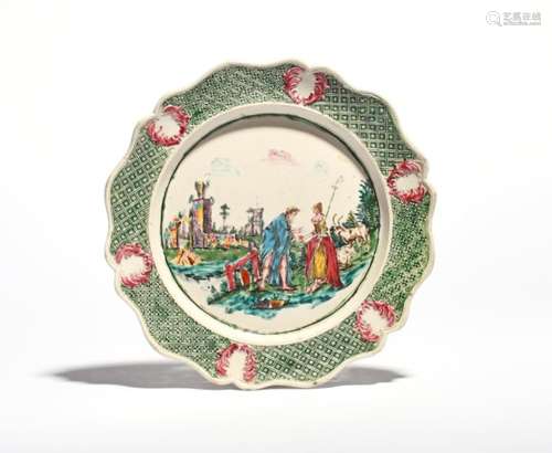 A salt-glazed stoneware plate c.1750, brightly enamelled with a bearded beggar or fortune teller