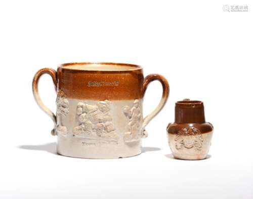 A brown stoneware two-handled tavern mug c.1830-40, sprigged with topers and trees, impressed '