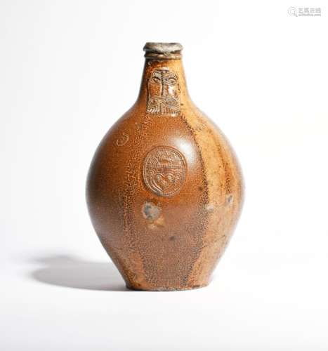 A large stoneware Bellarmine jug or Bartmannskrug 18th century, the ovoid form applied with a
