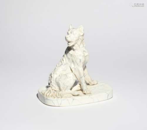 A Staffordshire marbled figure of a dog 1st half 19th century, seated in a relaxed pose with his