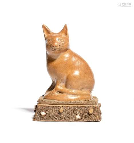 A rare Derbyshire brown stoneware model of a cat 1st half 19th century, seated on its haunches