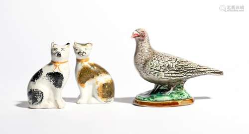 A pottery figural money box 19th century, modelled as a grey dove or pigeon, standing on an oval