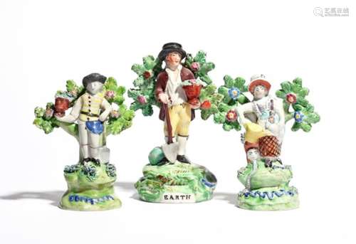 Three Staffordshire figures of gardeners c.1810-20, a small pair of Walton figures with a spade,