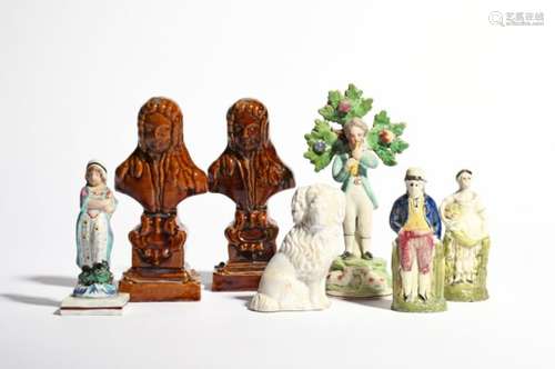 A group of Staffordshire figures 19th century, including two treacle-glazed busts of a wigged