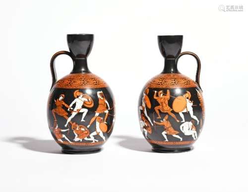 A pair of Samuel Alcock Etruscan revival jugs c.1856, printed with figures in battle on a black