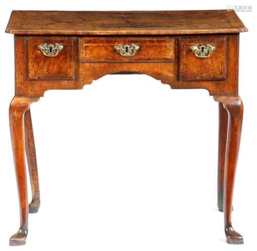 A George II walnut lowboy, cross and feather banded, the quarter veneered top with a full caddy