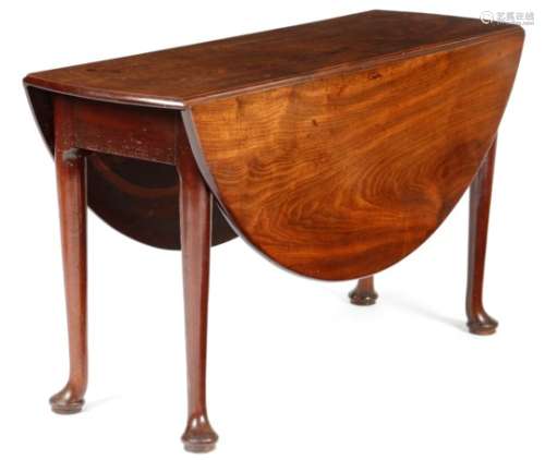 A George II mahogany dining table, the oval drop-leaf top on turned club legs and pad feet.