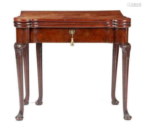 A George II mahogany combined tea, card and games table, the eared triple hinged top revealing a