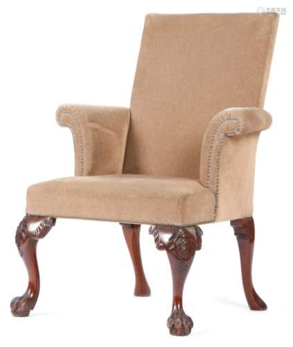 A 19th century Irish mahogany armchair in George II style, with a padded back and seat, on flower