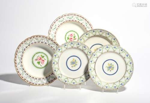 Three Sèvres-style English porcelain plates 1st half 19th century, painted with a central floral