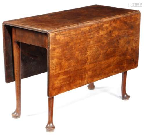 A George II mahogany dining table, the rectangular drop-leaf top on club legs and pad feet, 71.7cm