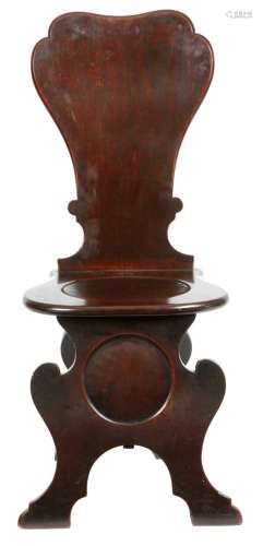 A George II mahogany sgabello hall chair, with a curved back and dished seat. Provenance: By