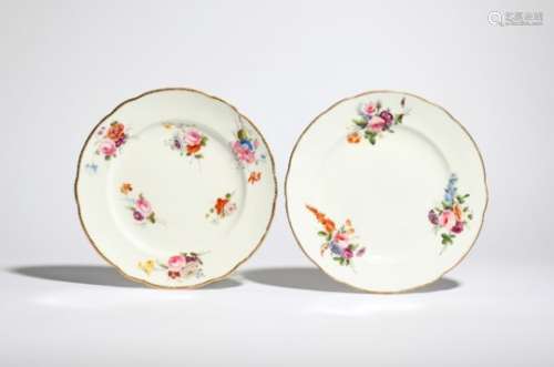 A near pair of Nantgarw plates c.1818-20, painted with small arrangements of colourful British