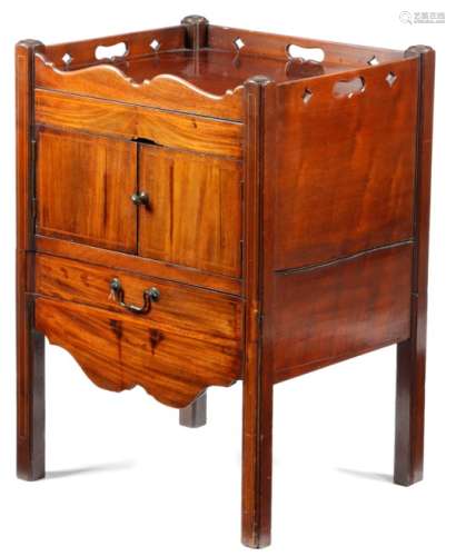 A George III mahogany tray-top bedside commode, inlaid with later stringing, the gallery pierced
