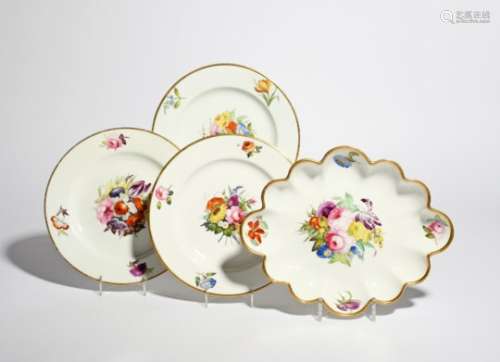 Three Derby dessert plates and a dish c.1810-15, boldly painted with central arrangements of flowers