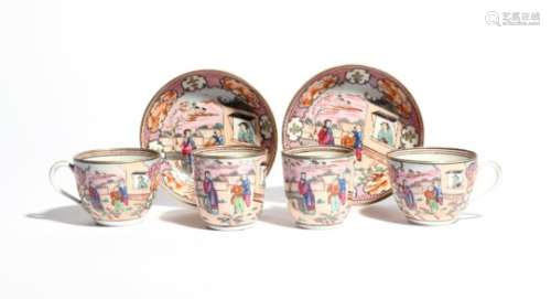 A good pair of New Hall trios c.1800, each trio comprising a teacup, coffee cup and saucer, brightly
