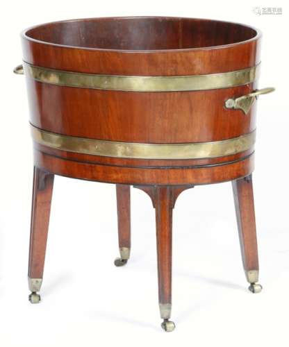 A George III mahogany and brass bound wine cooler on stand, of staved construction, the top inlaid