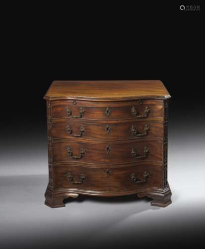 A small George III mahogany serpentine chest, the top with a moulded edge, above a baize lined