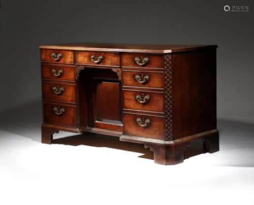 An early George III mahogany kneehole desk, the moulded edge top with part crossbanding and inlaid